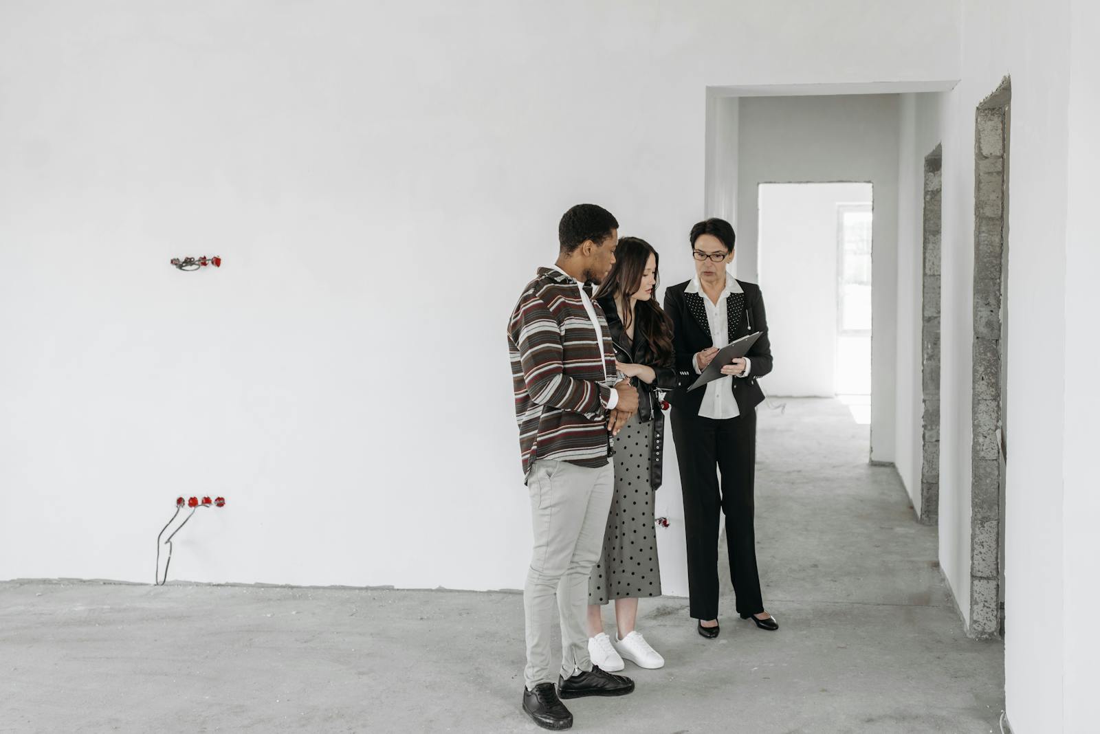 Couple Looking at Real Estate Agent Documents